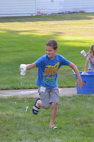 Child Running with Glass of Water