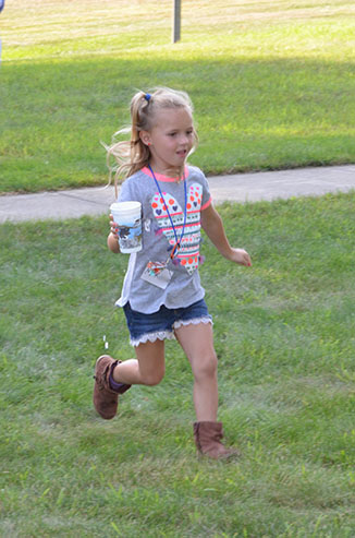 Child Running with Glass of Water