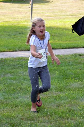 Child Running with Glass of Water