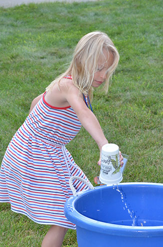 Child Dumping Glass of Water