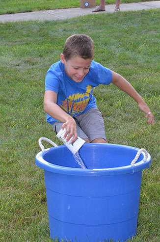 Child Dumping Glass of Water