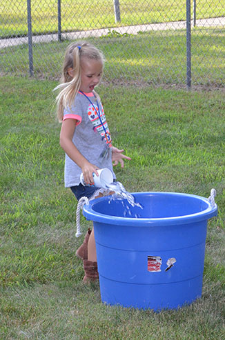 Child Dumping Glass of Water