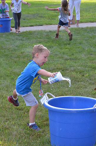 Child Dumping Glass of Water