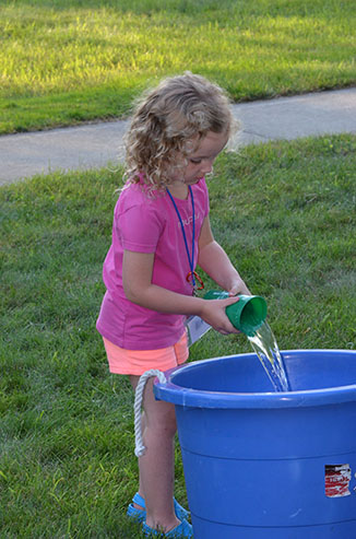 Child Dumping Glass of Water