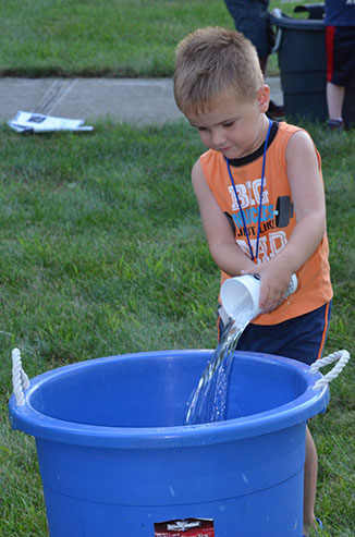 Child Dumping Glass of Water