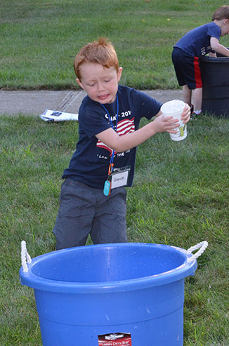 Child Dumping Glass of Water