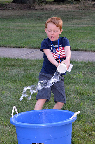 Child Dumping Glass of Water