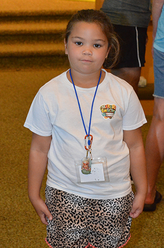 Child in T-Shirt with Maker Fun Factory Logo