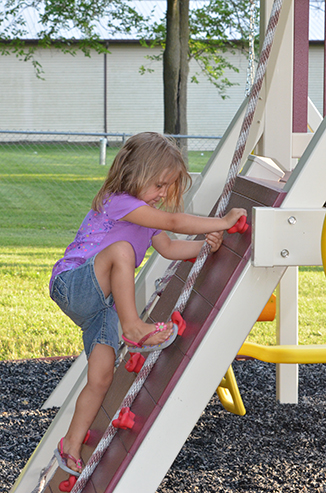 Child Playing on Playground