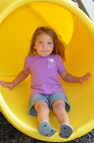 Child Playing on Playground