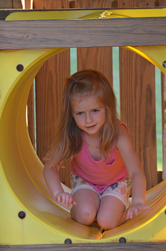 Child Playing on Playground