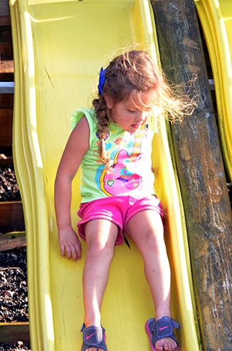 Child Playing on Playground