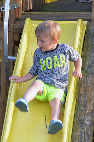 Child Going Down Slide