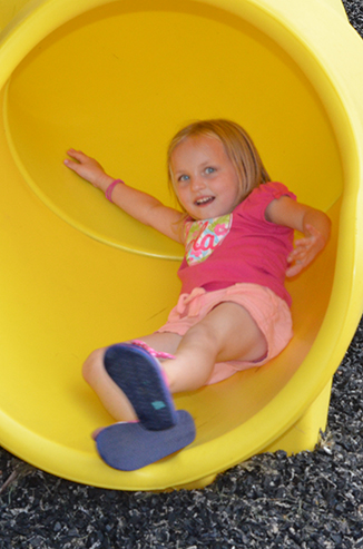 Child Going Down Slide