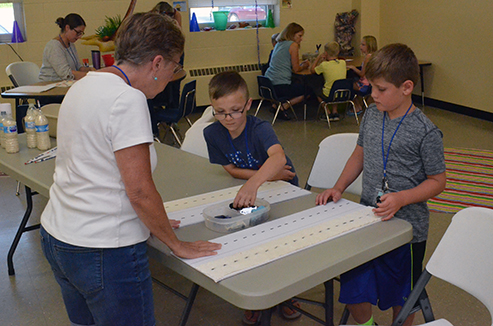 Children Learning About Friction