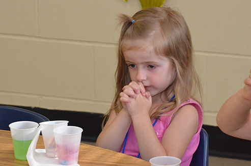 Child Praying Before Snack