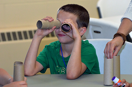 Child Testing His Binoculars