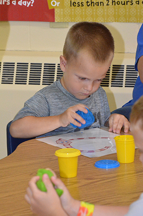 Child Working on Craft