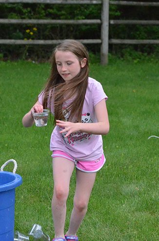 Child Walking with Glass of Water
