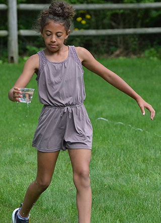 Child Walking with Glass of Water