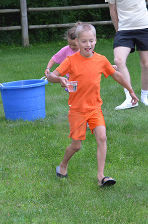 Child Walking with Cup of Water