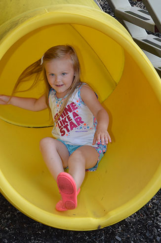 Child Going Down Slide