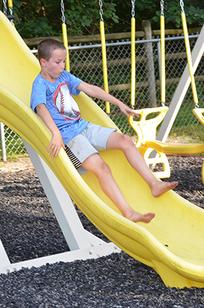 Child Going Down Slide