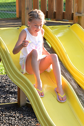 Child Going Down Slide