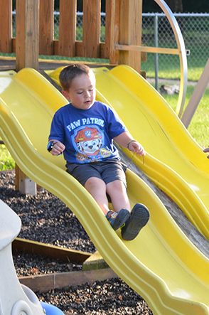 Child Going Down Slide