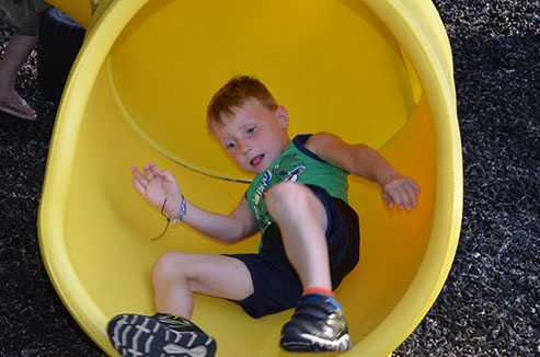 Child Going Down Slide