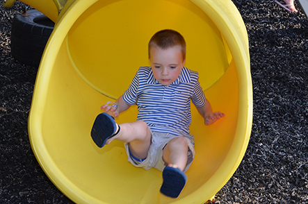 Child Going Down Slide