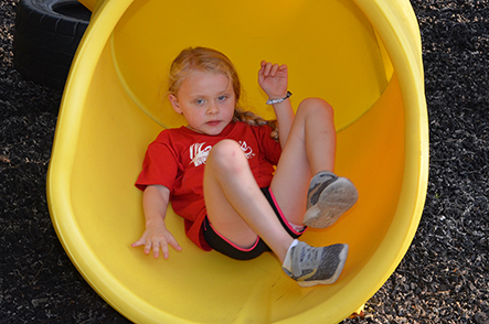 Child Going Down Slide