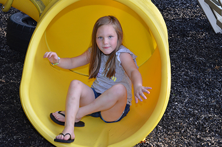 Child Going Down Slide