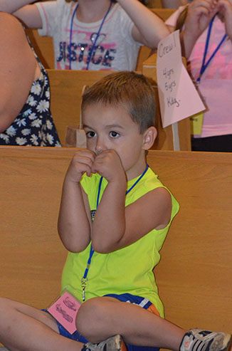 Child Forms a Heart with Arms & Hands