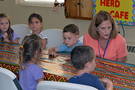 Children Discuss Bible Point with Rita During Snacks