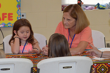 Children Discuss Bible Point with Rita During Snacks